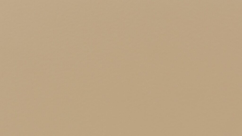 A solid beige background with a smooth texture. There are no distinct features or patterns visible.