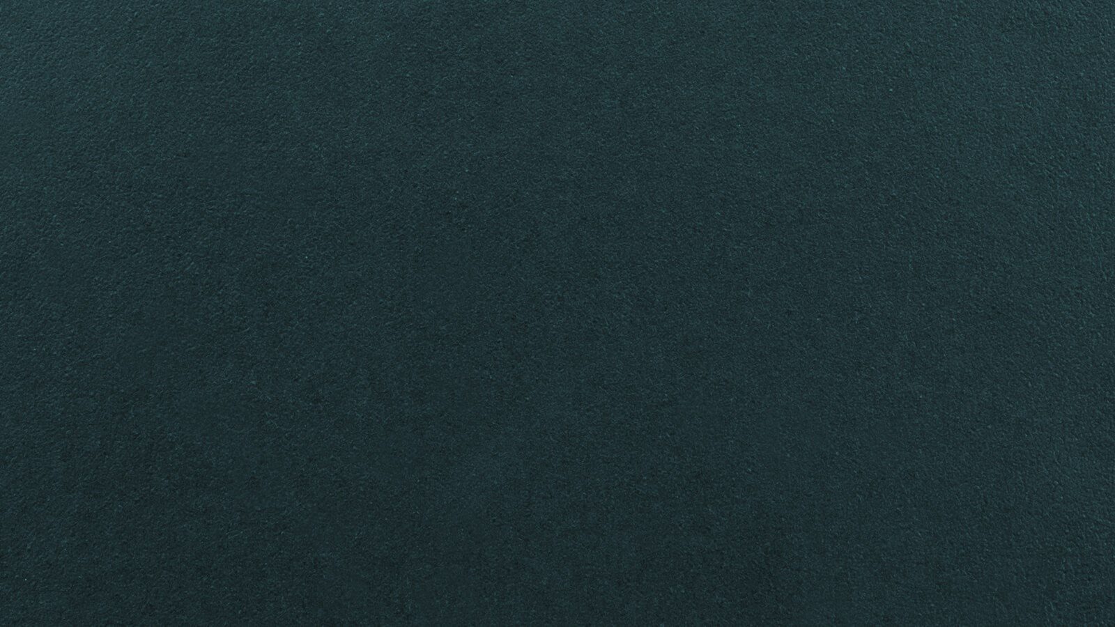 A solid, deep teal background. The surface appears smooth and uniform without any distinct patterns or textures.